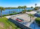 Two kayaks on the waterfront near a chain link fence at 725 N Manasota Key Rd # A, Englewood, FL 34223