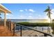 Water view from the backyard patio featuring a thatched palapa and outdoor furniture at 10204 46Th W Ave, Bradenton, FL 34210