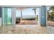 Balcony with views of the bay from the travertine tile floor through sliding glass doors at 10204 46Th W Ave, Bradenton, FL 34210