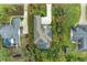 Aerial view of a house with pool and solar panels, surrounded by lush landscaping at 13534 5Th Ne Ave, Bradenton, FL 34212