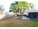 Large backyard with grassy area and wooden fence at 1416 Glenmere Dr, Brandon, FL 33511