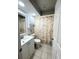 Bathroom with a tub, shower, and white vanity at 1416 Glenmere Dr, Brandon, FL 33511