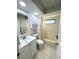 Bathroom with a tub, shower, and white vanity at 1416 Glenmere Dr, Brandon, FL 33511