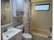 Clean bathroom with a tub, shower, and white vanity at 1416 Glenmere Dr, Brandon, FL 33511