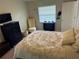 Bright bedroom with a queen bed, dresser, and window coverings at 1416 Glenmere Dr, Brandon, FL 33511