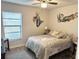 Bright bedroom with a queen-size bed and mermaid wall art at 1416 Glenmere Dr, Brandon, FL 33511