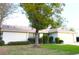 Single story home with attached garage and manicured lawn at 1416 Glenmere Dr, Brandon, FL 33511