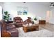 Relaxing living room with leather reclining sofas and wood coffee table at 1416 Glenmere Dr, Brandon, FL 33511