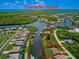 Property aerial view showing canal access in Charlotte Harbor community at 15124 Leipzig Cir, Port Charlotte, FL 33981