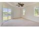 Spacious bedroom with water view and ceiling fan at 15124 Leipzig Cir, Port Charlotte, FL 33981