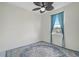 Bedroom with ceiling fan and water view at 15124 Leipzig Cir, Port Charlotte, FL 33981