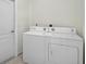 Bright laundry room with washer and dryer at 15124 Leipzig Cir, Port Charlotte, FL 33981