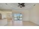 Spacious living area with tile floors,sliding glass doors, and water view at 15124 Leipzig Cir, Port Charlotte, FL 33981