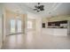 Open floorplan living area with kitchen,tile floor, and entryway at 15124 Leipzig Cir, Port Charlotte, FL 33981