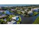 Stunning aerial view of waterfront homes, boat docks, and beautiful coastal scenery at 1912 Harbourside Dr # 603, Longboat Key, FL 34228