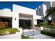 Exterior of The Clubhouse at Fairway Bay with lush landscaping at 1912 Harbourside Dr # 603, Longboat Key, FL 34228