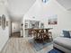 Bright dining area with a vaulted ceiling, wood table, and seamless flow into the living spaces at 1912 Harbourside Dr # 603, Longboat Key, FL 34228