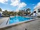 Community swimming pool with plenty of lounge chairs at 1912 Harbourside Dr # 603, Longboat Key, FL 34228