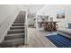 Modern staircase with carpeted steps and a light-colored railing at 1912 Harbourside Dr # 603, Longboat Key, FL 34228