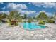 Resort-style pool with lounge chairs and palm trees at 27475 Janzen Ct, Englewood, FL 34223