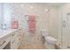 Modern bathroom with pebble tile and walk-in shower at 3330 Gulf Of Mexico Dr # 205D, Longboat Key, FL 34228