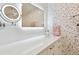 Chic bathroom features a modern vanity and pebble tile at 3330 Gulf Of Mexico Dr # 205D, Longboat Key, FL 34228