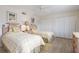 Guest bedroom with twin beds and plantation shutters at 3330 Gulf Of Mexico Dr # 205D, Longboat Key, FL 34228