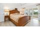 Spacious main bedroom with water views and king-size bed at 3330 Gulf Of Mexico Dr # 205D, Longboat Key, FL 34228