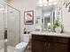 Bathroom with shower, toilet and granite vanity at 4925 Surfside Cir, Bradenton, FL 34211