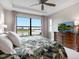 Spacious bedroom with lake view and large windows at 4925 Surfside Cir, Bradenton, FL 34211