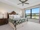 Main bedroom with water view and a large bed at 4925 Surfside Cir, Bradenton, FL 34211