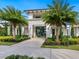 Inviting entrance to community building with palm trees and landscaping at 4925 Surfside Cir, Bradenton, FL 34211