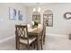 Elegant dining room with a wood table and ornate wall decor at 4925 Surfside Cir, Bradenton, FL 34211