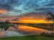 Stunning sunset view over lake with colorful clouds at 4925 Surfside Cir, Bradenton, FL 34211