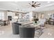 Open living room with light gray sofas and large windows at 4925 Surfside Cir, Bradenton, FL 34211