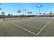 Well-maintained tennis court with a covered seating area at 4925 Surfside Cir, Bradenton, FL 34211