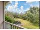 View of backyard with pond and lush landscaping at 5581 Key West Pl # 5581, Bradenton, FL 34203