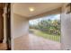 Screened balcony overlooking a pond and lush landscape at 5581 Key West Pl # 5581, Bradenton, FL 34203