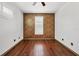 Well-lit bedroom with wood floors and accent wall at 5581 Key West Pl # 5581, Bradenton, FL 34203