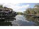 Calm waterway with private boat docks and lush landscaping at 5581 Key West Pl # 5581, Bradenton, FL 34203