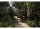 Wooden footbridge pathway through lush foliage at 5581 Key West Pl # 5581, Bradenton, FL 34203