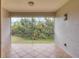 Screened balcony overlooking a lush green landscape at 5581 Key West Pl # 5581, Bradenton, FL 34203