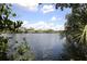 Calm waterfront view with houses visible in the distance at 5581 Key West Pl # 5581, Bradenton, FL 34203