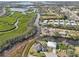 Aerial view showing home's waterfront location and surrounding area at 609 Colonial Bay Dr, Nokomis, FL 34275