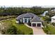 Luxury waterfront home with tile roof and two-car garage at 609 Colonial Bay Dr, Nokomis, FL 34275