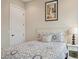 Cozy bedroom with patterned bedding and nightstand at 609 Colonial Bay Dr, Nokomis, FL 34275