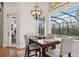 Breakfast nook with water views and hardwood floors at 609 Colonial Bay Dr, Nokomis, FL 34275