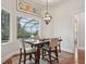 Breakfast nook with water views and hardwood floors at 609 Colonial Bay Dr, Nokomis, FL 34275