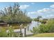 Private dock on calm waterway, perfect for relaxing at 609 Colonial Bay Dr, Nokomis, FL 34275