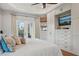 Main bedroom with large walk-in closet and built in TV at 609 Colonial Bay Dr, Nokomis, FL 34275